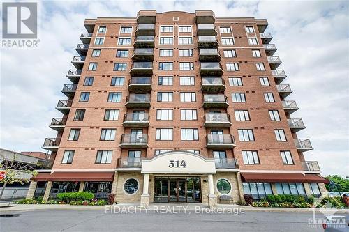 101 - 314 Central Park Drive, Ottawa, ON - Outdoor With Balcony With Facade