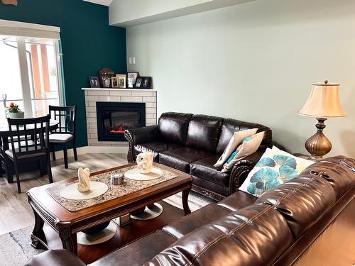 315 - 5570 Broadwater Rd, Castlegar, BC - Indoor Photo Showing Living Room With Fireplace