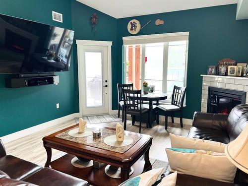 315 - 5570 Broadwater Rd, Castlegar, BC - Indoor Photo Showing Living Room With Fireplace