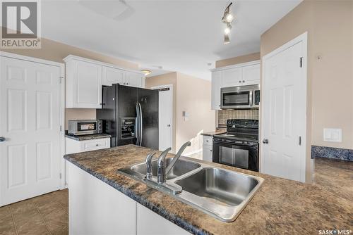 715 Lamarsh Lane, Saskatoon, SK - Indoor Photo Showing Kitchen With Double Sink