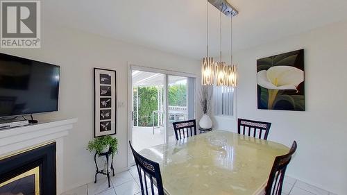 24 Sandpiper Place, Osoyoos, BC - Indoor Photo Showing Dining Room With Fireplace