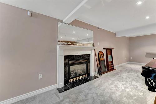 Natural Gas Fireplace creates a nice ambiance - 40 Dunrobin Drive, Caledonia, ON - Indoor With Fireplace