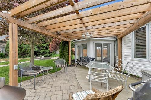 More entertainment space including a Natural Gas Fire Pit and BBQ Hookup - 40 Dunrobin Drive, Caledonia, ON - Outdoor With Exterior