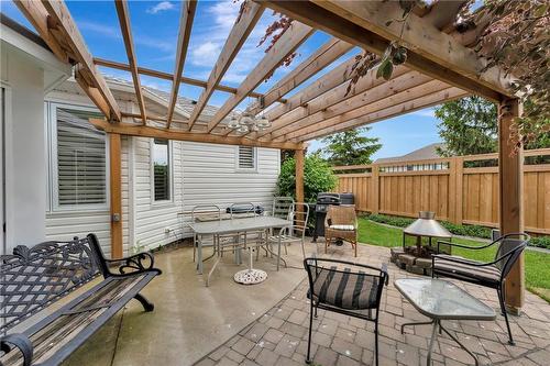 Picture beautiful climbing vines or flowers that could creep across the Pergola - 40 Dunrobin Drive, Caledonia, ON - Outdoor With Deck Patio Veranda With Exterior