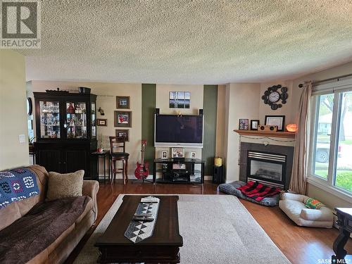 205 1St Street E, Carlyle, SK - Indoor Photo Showing Living Room With Fireplace