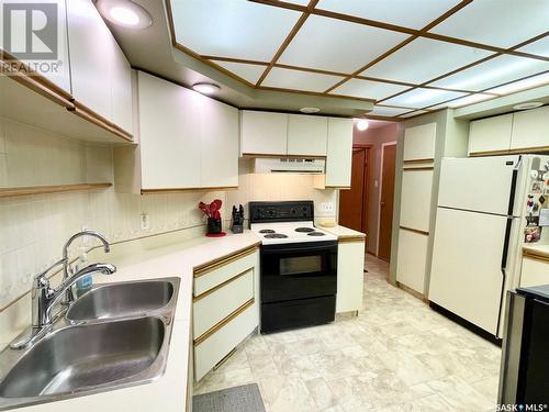 104 250 Athabasca Street E, Moose Jaw, SK - Indoor Photo Showing Kitchen With Double Sink