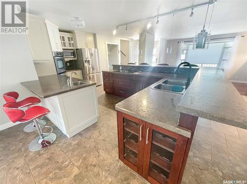 206 Clinton Place, Swift Current, SK - Indoor Photo Showing Kitchen With Double Sink