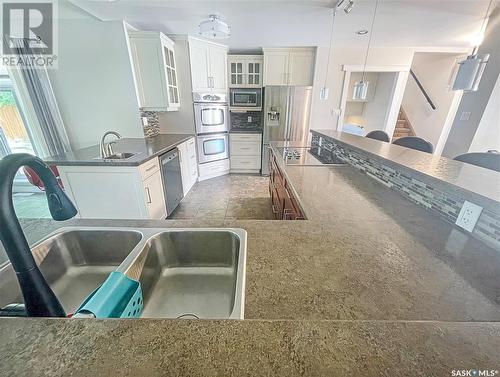 206 Clinton Place, Swift Current, SK - Indoor Photo Showing Kitchen With Double Sink