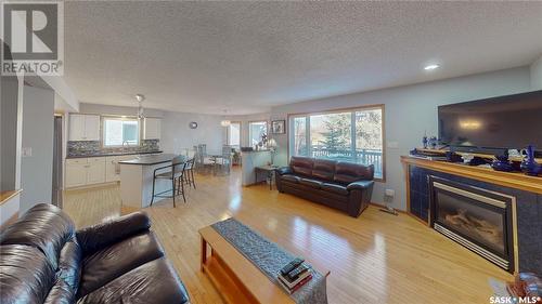 3566 Waddell Crescent E, Regina, SK - Indoor Photo Showing Living Room With Fireplace