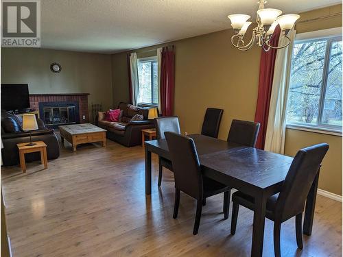 4714 Parker Court, 108 Mile Ranch, BC - Indoor Photo Showing Dining Room With Fireplace