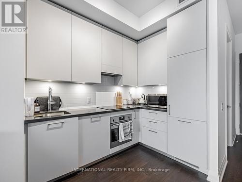 210 - 33 Frederick Todd Way, Toronto (Thorncliffe Park), ON - Indoor Photo Showing Kitchen With Upgraded Kitchen