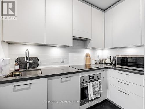 210 - 33 Frederick Todd Way, Toronto (Thorncliffe Park), ON - Indoor Photo Showing Kitchen With Upgraded Kitchen