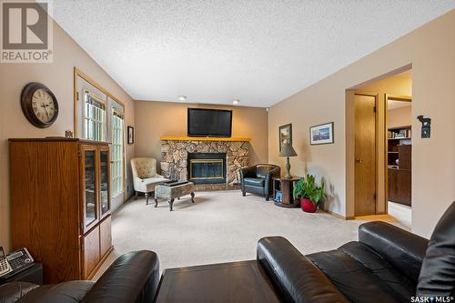 2707 Jolly Place E, Regina, SK - Indoor Photo Showing Living Room With Fireplace