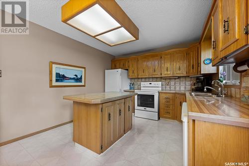 2707 Jolly Place E, Regina, SK - Indoor Photo Showing Kitchen With Double Sink