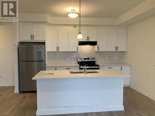 B030 - 142 Foamflower Place, Waterloo, ON - Indoor Photo Showing Kitchen With Double Sink