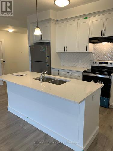 B030 - 142 Foamflower Place, Waterloo, ON - Indoor Photo Showing Kitchen With Double Sink