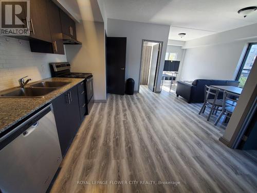A 407 - 275 Larch Street N, Waterloo, ON - Indoor Photo Showing Kitchen With Double Sink