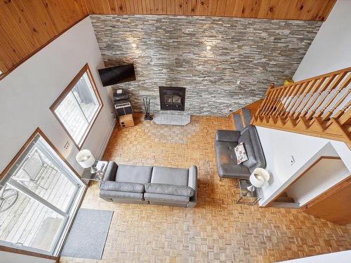 Living room - 77 572E Avenue, Saint-Hippolyte, QC - Indoor Photo Showing Other Room With Fireplace