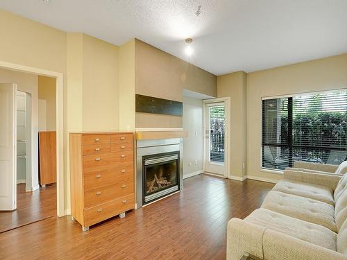 Surrey, BC - Indoor Photo Showing Living Room With Fireplace