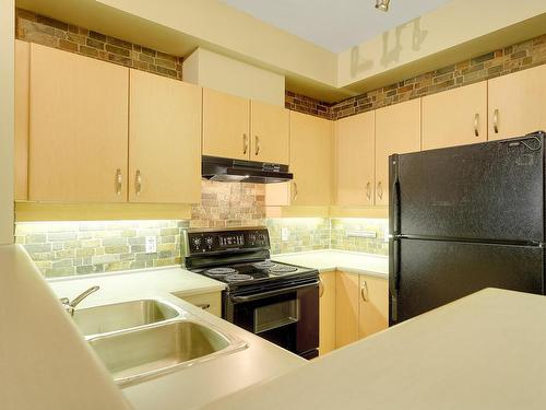 Surrey, BC - Indoor Photo Showing Kitchen With Double Sink