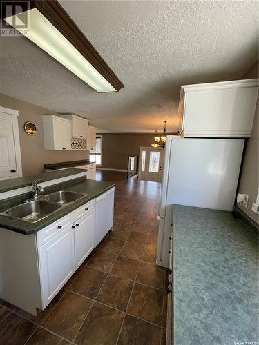 513 Hudson Street, Hudson Bay, SK - Indoor Photo Showing Kitchen With Double Sink