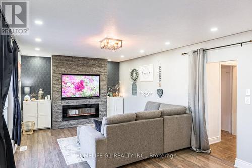 17 Stonegate Drive, St. Catharines, ON - Indoor Photo Showing Living Room With Fireplace