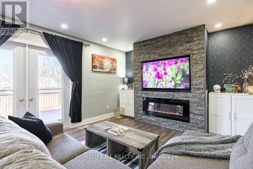 17 Stonegate Drive, St. Catharines, ON - Indoor Photo Showing Living Room With Fireplace