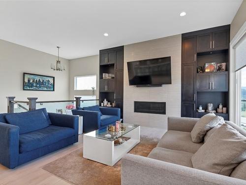 6548 Blackcomb Place, Vernon, BC - Indoor Photo Showing Living Room With Fireplace