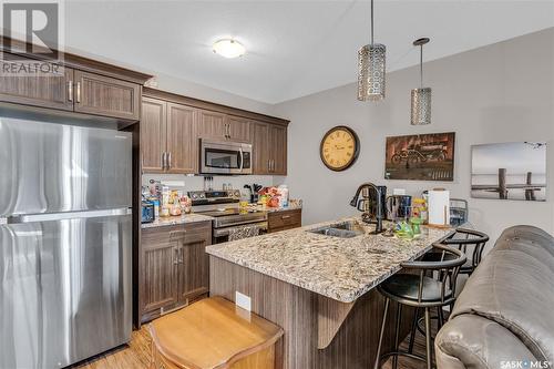 317 1715 Badham Boulevard, Regina, SK - Indoor Photo Showing Kitchen With Double Sink