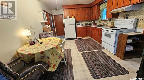 711 1St Avenue E, Ponteix, SK - Indoor Photo Showing Kitchen With Double Sink