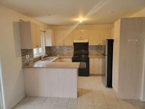 641 Armstrong Blvd, Milton, ON - Indoor Photo Showing Kitchen With Double Sink