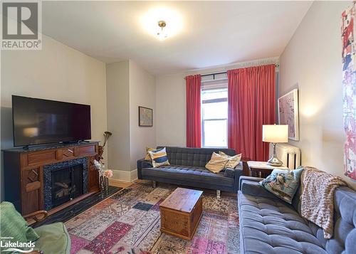 120 Brant Street E, Orillia, ON - Indoor Photo Showing Living Room With Fireplace