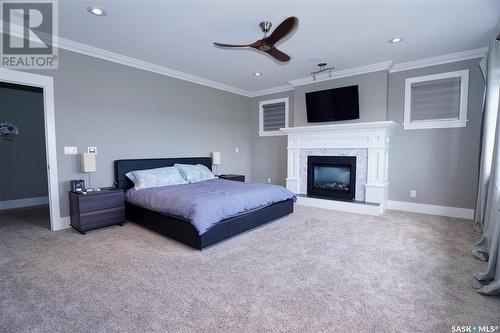 194 Sinclair Crescent, Saskatoon, SK - Indoor Photo Showing Bedroom With Fireplace