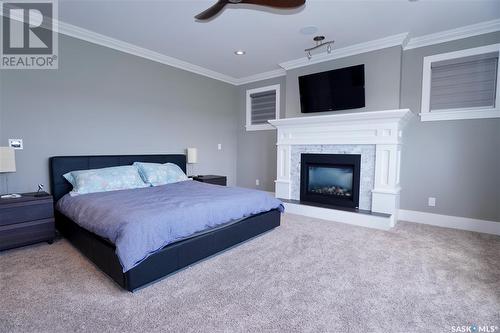 194 Sinclair Crescent, Saskatoon, SK - Indoor Photo Showing Bedroom With Fireplace