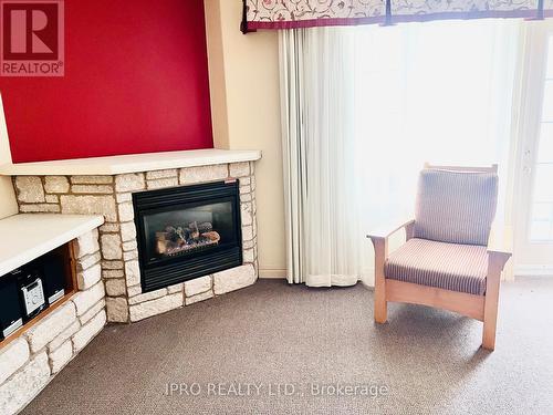 2320/21 - 90 Highland Drive, Oro-Medonte (Horseshoe Valley), ON - Indoor Photo Showing Living Room With Fireplace