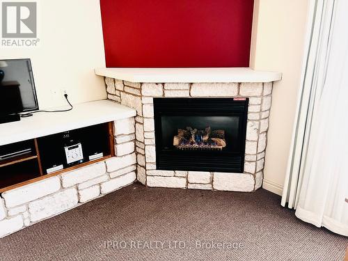 2320/21 - 90 Highland Drive, Oro-Medonte (Horseshoe Valley), ON - Indoor Photo Showing Living Room With Fireplace