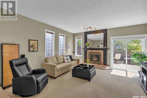 211 Gathercole Crescent, Saskatoon, SK - Indoor Photo Showing Living Room With Fireplace