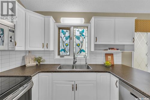 211 Gathercole Crescent, Saskatoon, SK - Indoor Photo Showing Kitchen With Double Sink