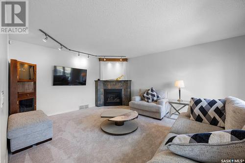 5054 Wascana Vista Court, Regina, SK - Indoor Photo Showing Living Room With Fireplace