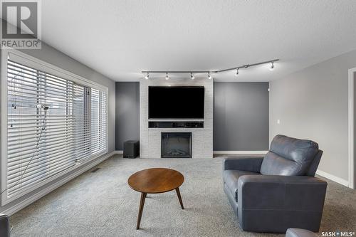5054 Wascana Vista Court, Regina, SK - Indoor Photo Showing Living Room With Fireplace