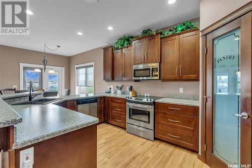 303 Brookside Drive, Warman, SK - Indoor Photo Showing Kitchen With Double Sink