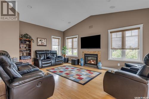 303 Brookside Drive, Warman, SK - Indoor Photo Showing Living Room With Fireplace