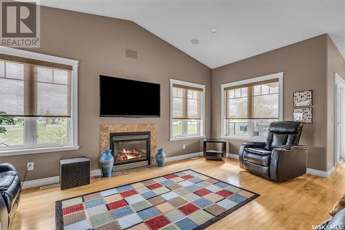 303 Brookside Drive, Warman, SK - Indoor Photo Showing Living Room With Fireplace