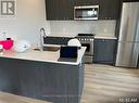416 - 312 Erb Street W, Waterloo, ON  - Indoor Photo Showing Kitchen With Double Sink 