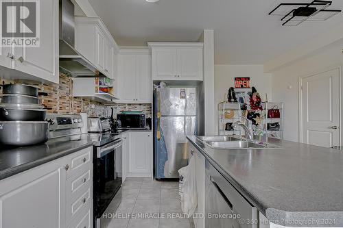 64 Finegan Circle, Brampton, ON - Indoor Photo Showing Kitchen With Double Sink
