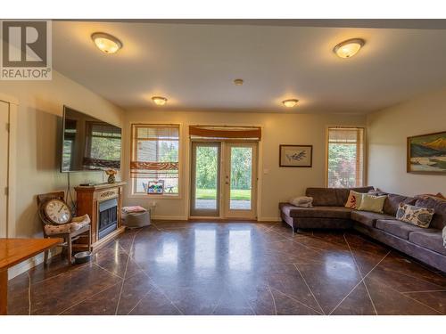 250 1St Avenue, Christina Lake, BC - Indoor Photo Showing Living Room With Fireplace