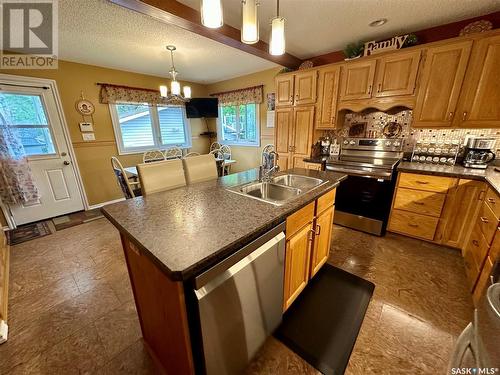 12 Sandison Crescent, Regina, SK - Indoor Photo Showing Kitchen With Double Sink
