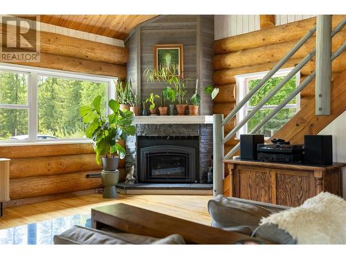 28 Begbie Road, Cherryville, BC - Indoor Photo Showing Living Room With Fireplace