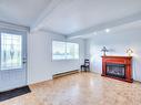 Salle familiale - 8160 Boul. Des Mille-Îles, Laval (Saint-François), QC  - Indoor Photo Showing Living Room With Fireplace 