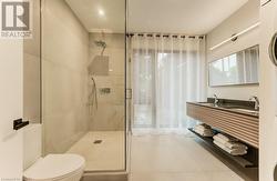 Boasting luxurious bathrooms, including a main 4-piece bath with double sinks and a sleek floating quartz vanity. - 